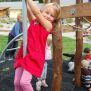 Little girl climbs on Sherwood
